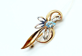 Золотая брошь с топазом