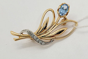 Золотая брошь с топазом и фианитами