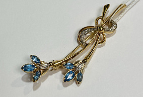 Золотая брошь с синтетическим камнем 